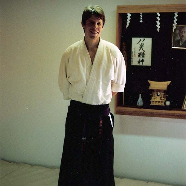 Shihan Brian W. Workman Smiling, Wearing Hakama in Dojo