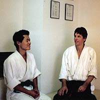 Koji and Shihan Brian Workman talking in dojo