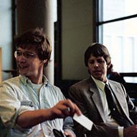 Ralph showing business card.  Shihan Brian Workman waiting in LAX for flight